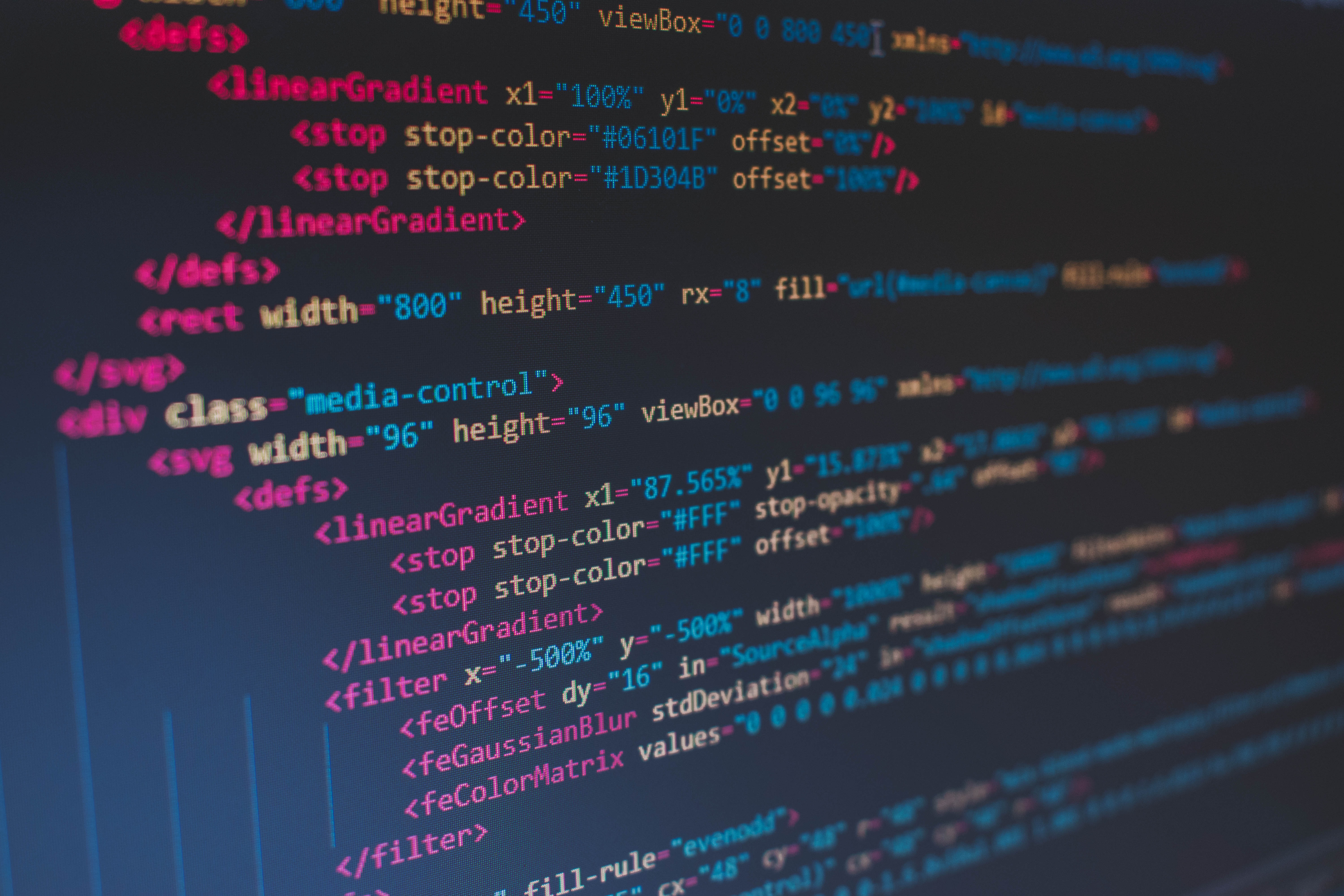 Decorative image of computer screen showing programming code